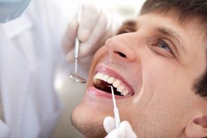 14290752 - a man visiting a dentist